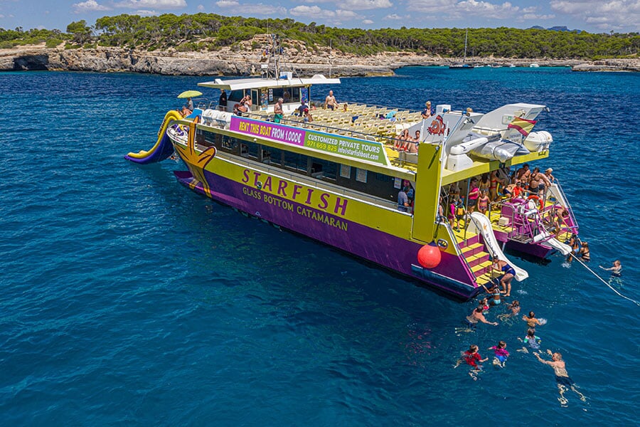 Catamaran sailing near Cala Mondragó
