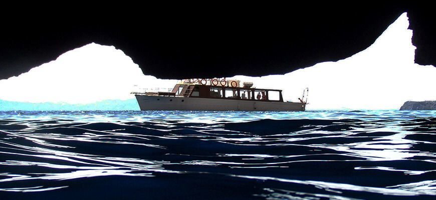 view of the boat from the blue cave