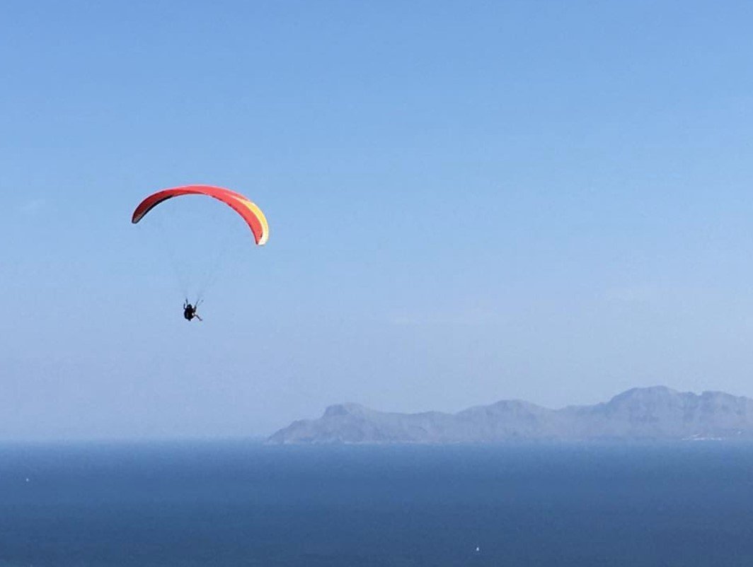 flying over alcudia bay in paraglide
