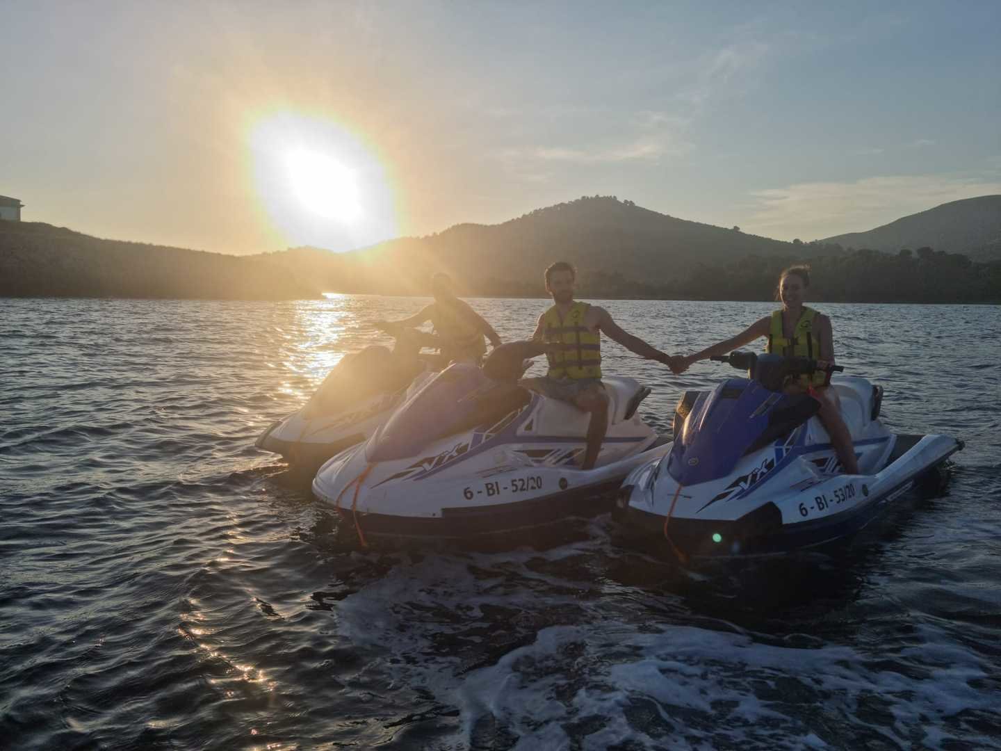 driving jet ski at sunset